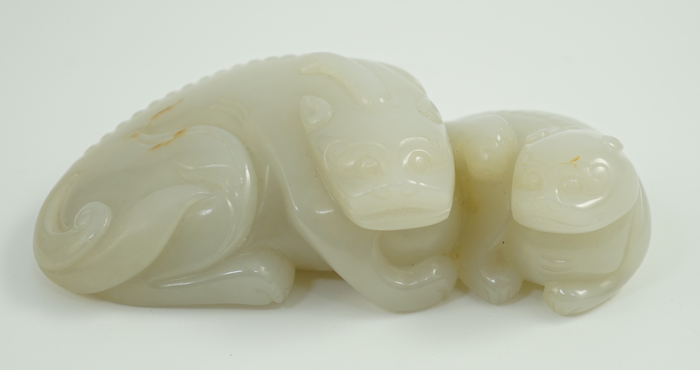 A Chinese white jade mythical beast group, 12cm long